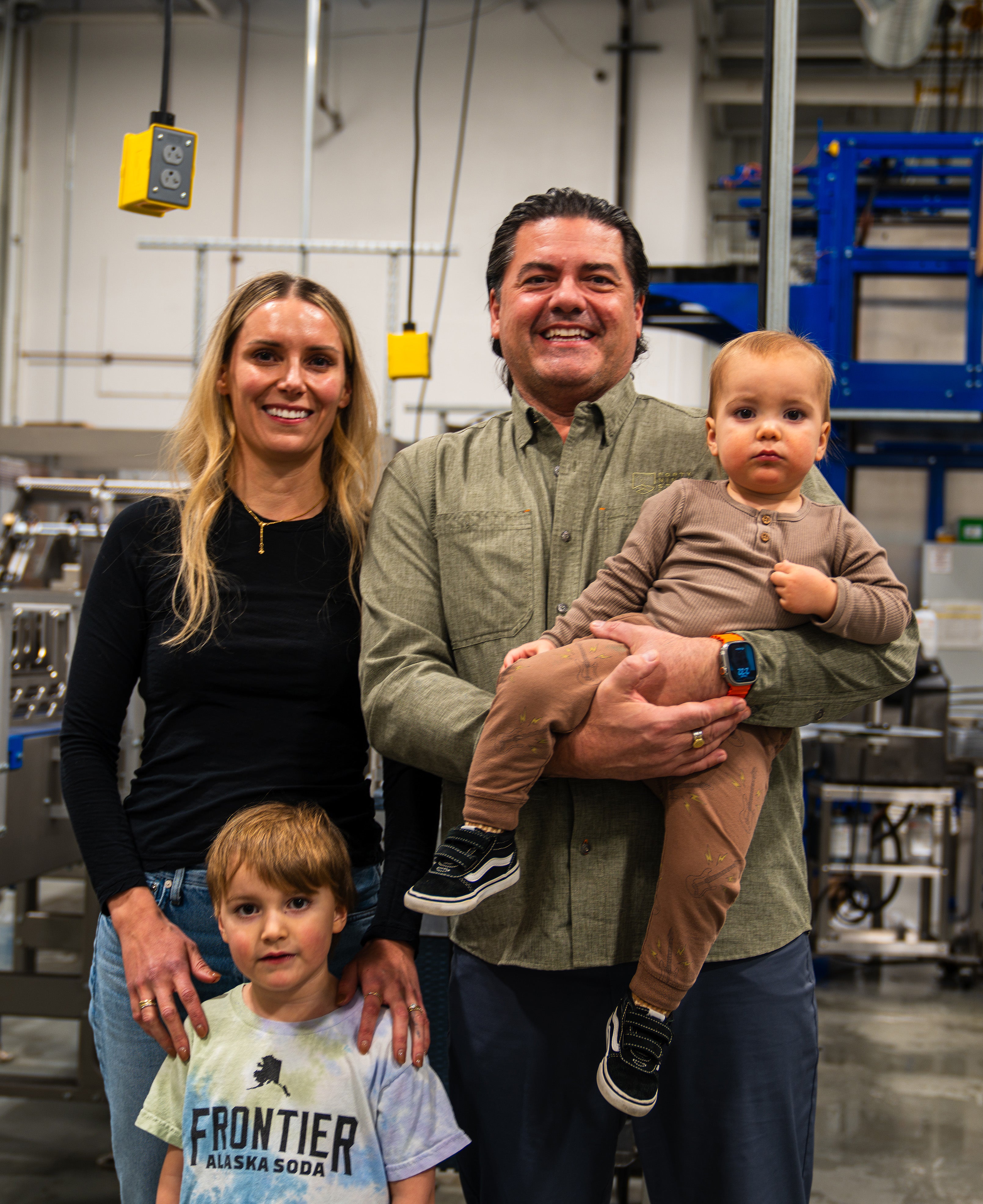 Family of four in a factory setting